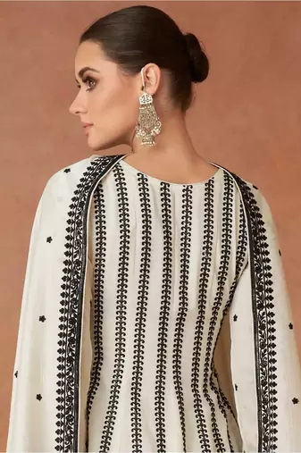 Cream embroidered work silk bland fabric kurta palazzo with dupatta.