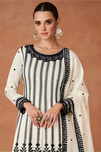 Cream embroidered work silk bland fabric kurta palazzo with dupatta.