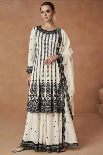 Cream embroidered work silk bland fabric kurta palazzo with dupatta.