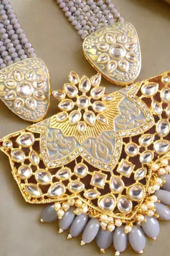 Gold designer floral meenakari kundan studed onyx stone multilayer necklace set with earrings