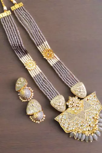 Gold designer floral meenakari kundan studed onyx stone multilayer necklace set with earrings