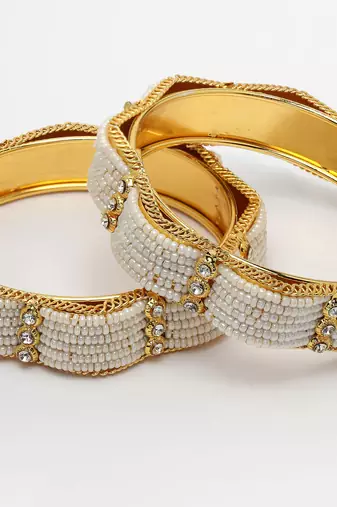 Women set of 2 gold-plated pearl handcrafted traditional bangles