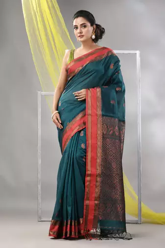 Emerald green silk matka soft saree with paisley motifs
