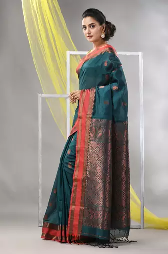 Emerald green silk matka soft saree with paisley motifs