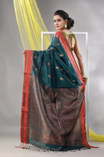 Emerald green silk matka soft saree with paisley motifs