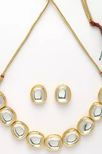 Women gold  handcrafted kundan-studded jewellery set