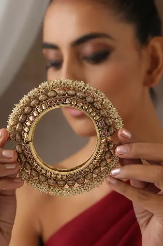 Gold tone pearl temple work kada