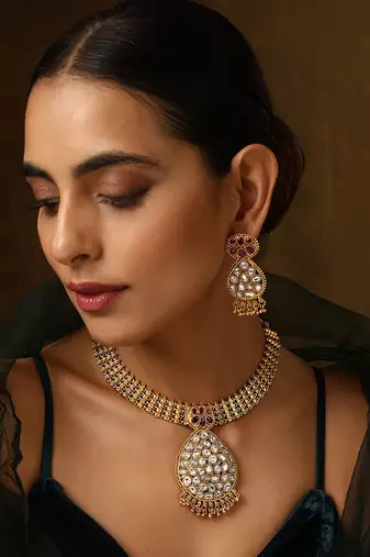 Red gold tone kundan temple necklace set