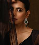 Green silver tone polki dangler earrings