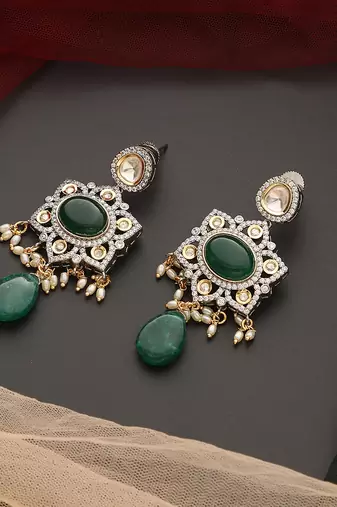 Green silver tone polki dangler earrings