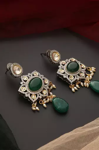 Green silver tone polki dangler earrings