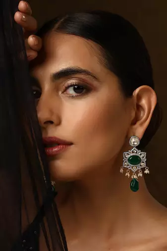 Green silver tone polki dangler earrings