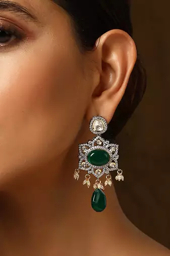 Green silver tone polki dangler earrings