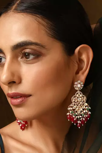 Red gold tone polki dangler earrings
