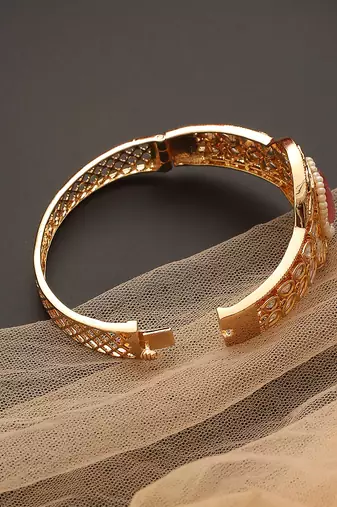 Pink gold tone kundan bracelet
