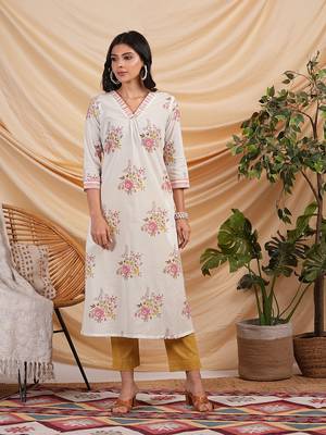A-line floral printed cotton kurta with v neck and pocket detail. 1