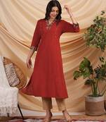 A line cotton kurta with hand applique and embroidery detailling.