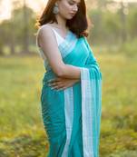Handloom Turquoise Blue Saree With White Border And Tassels - Without Blouse