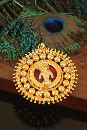 Kerala style gold plated palakka krishna pendant