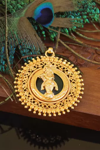 Kerala style gold plated palakka krishna pendant