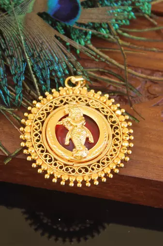 Kerala style gold plated palakka krishna pendant