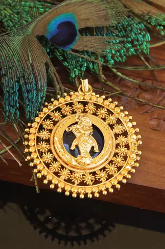 Kerala style gold plated palakka krishna pendant