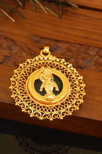 Kerala style gold plated palakka krishna pendant
