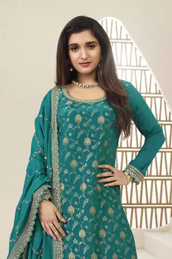 Green colour zari woven chinnon fabric heavy partywear sharara dress