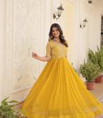 Women's yellow faux blooming with embroidered zari sequins work luxury gown
