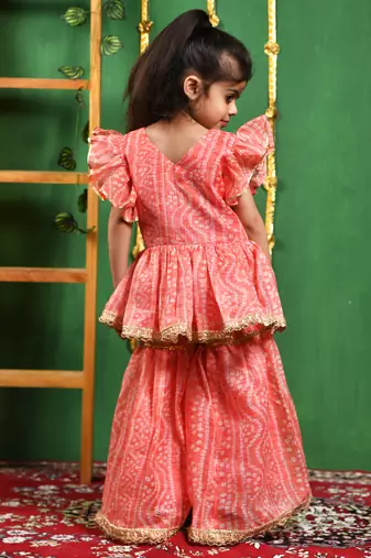 Girl's peach leheriya printed kurti with lace work sharara set