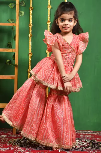Girl's peach leheriya printed kurti with lace work sharara set