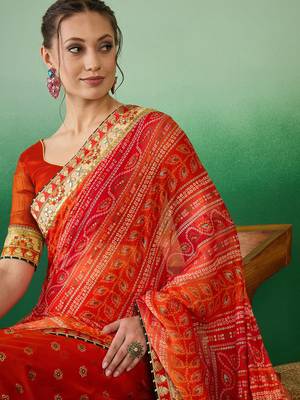 Riva enterprise women's soft mose chiffon with bhandhani print with heavy lace saree with blouse 1