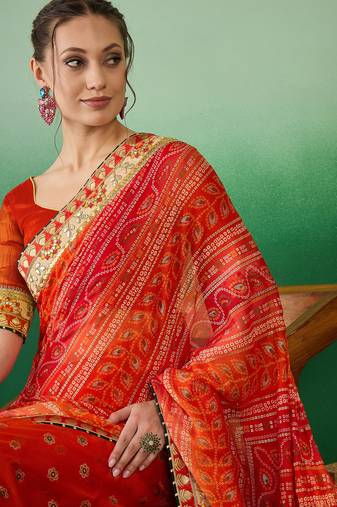 Riva enterprise women's soft mose chiffon with bhandhani print with heavy lace saree with blouse