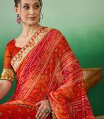 Riva enterprise women's soft mose chiffon with bhandhani print with heavy lace saree with blouse