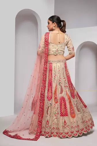 luxurious silk beautiful peacock embroidery in Flamingo Pink colours  bridal lehenga.