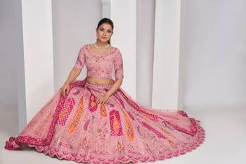 luxurious silk beautiful peacock embroidery in Flamingo Pink colours  bridal lehenga. 1