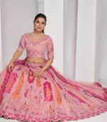 luxurious silk beautiful peacock embroidery in Flamingo Pink colours  bridal lehenga.