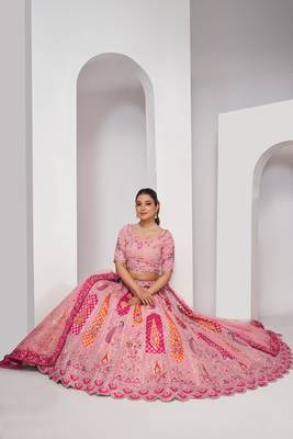 luxurious silk beautiful peacock embroidery in Flamingo Pink colours  bridal lehenga. 2