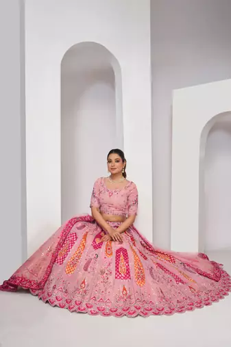 luxurious silk beautiful peacock embroidery in Flamingo Pink colours  bridal lehenga.