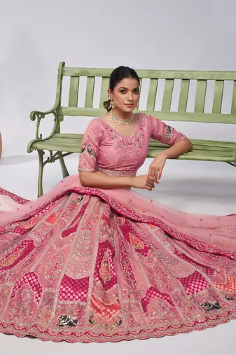 Bridal Pink lehenga is made with Orgenza Silk fabric and features intricate paisley Motifs