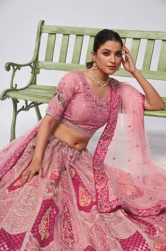Bridal Pink lehenga is made with Orgenza Silk fabric and features intricate paisley Motifs