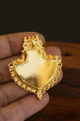 Kerala style gold plated palakka krishna pendant