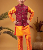 Boy's maroon nehru jacket with orange kurta and pyjama set