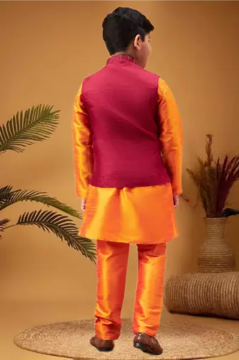 Boy's maroon nehru jacket with orange kurta and pyjama set