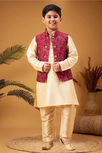Boy's maroon nehru jacket with gold kurta and pyjama set