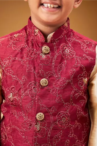 Boy's maroon nehru jacket with gold kurta and pyjama set