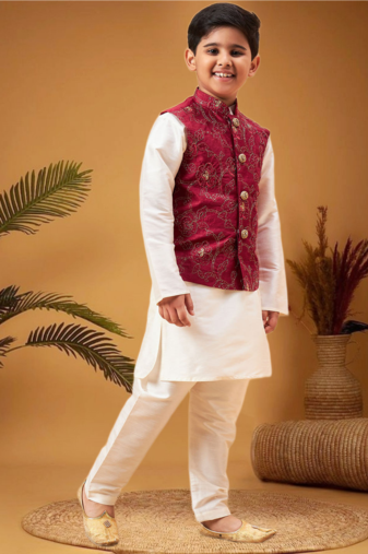 Boy's maroon nehru jacket with cream kurta and pyjama set