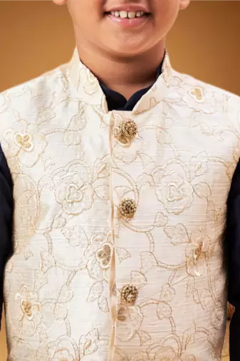 Boy's beige woven nehru jacket with navy blue kurta pyjama set