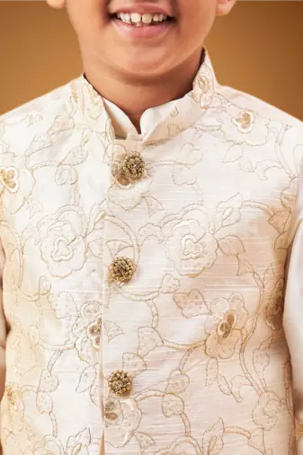 Boy's beige nehru jacket with cream kurta and pyjama set