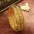 Golden Harmony: Set of 2 Leaf-Shaped Bangles